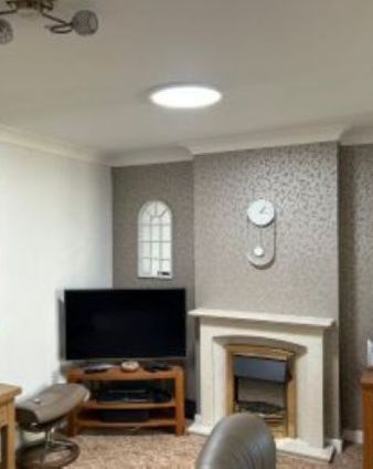 Solatube providing sun light through a daylight tunnel into a living room